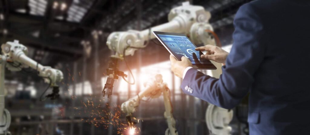Manufacturing engineer using a mobile tablet on the shop floor to replace paper spreadsheets.